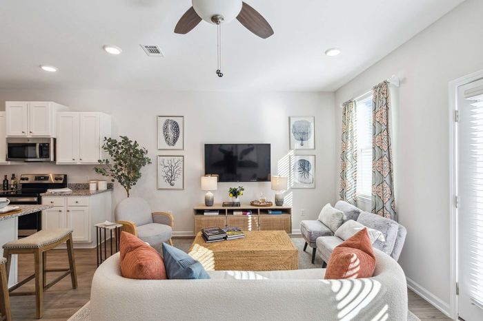Furnished Living Room with sunlit windows