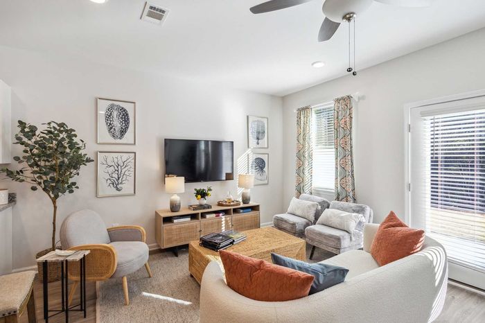 Furnished Living Room with sunlit windows
