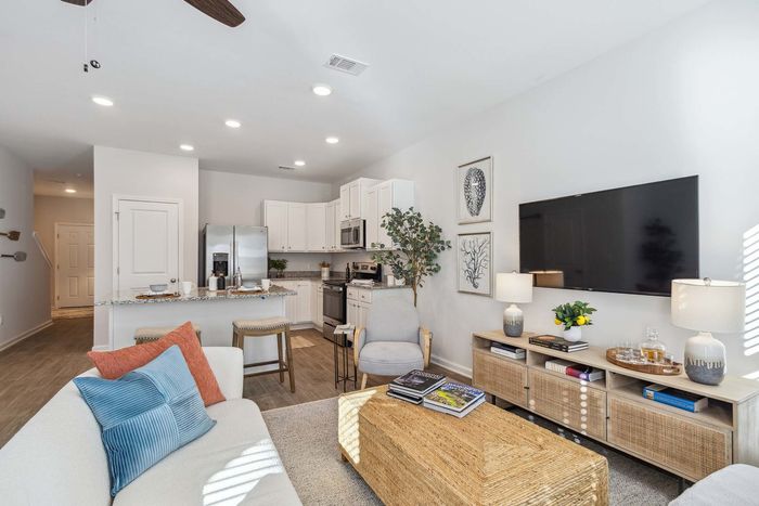 Furnished Living Area with Open Kitchen in background