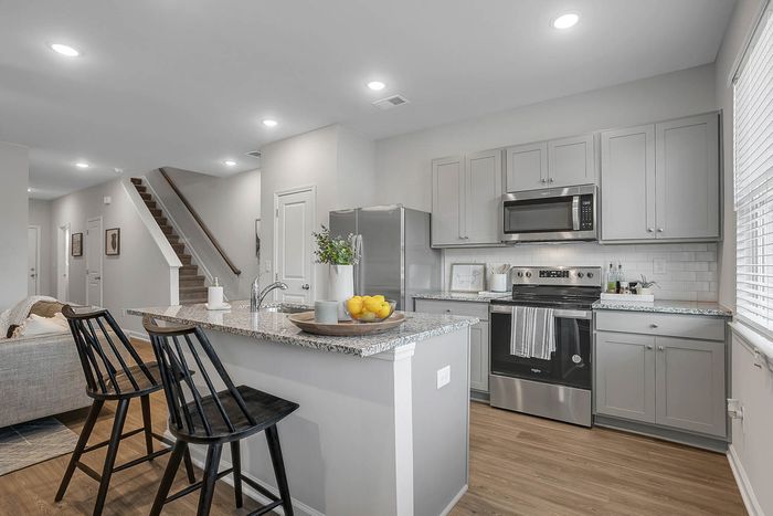 Furnished kitchen area and breakfast bar