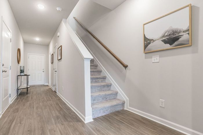 mainfloor staircase leading up to 2nd floor landing