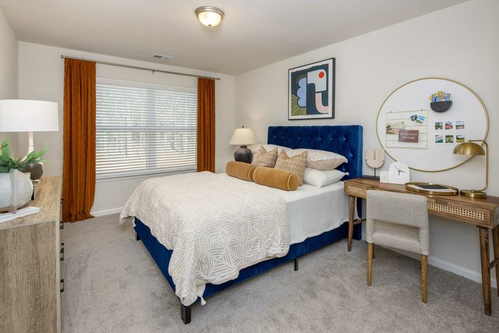 furnished bedroom with carpet
