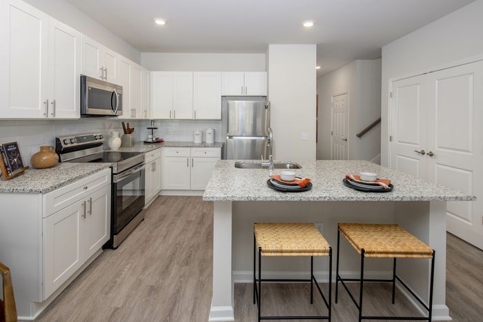 kitchen with white cabinets and vinyl plank flooring