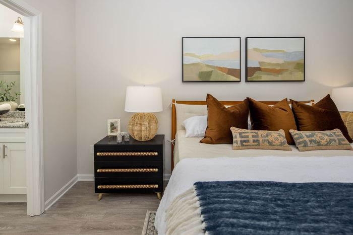 main bedroom with vinyl plank flooring
