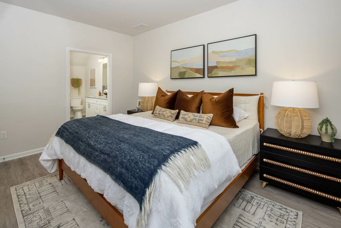 main bedroom with vinyl plank flooring