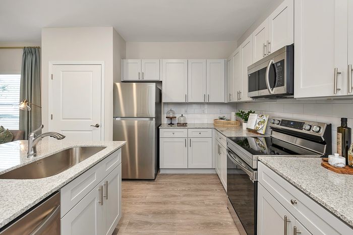 Kitchen with stainless steel appliances and white cabinets