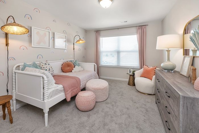 Furnished childrens bedroom with day bed and one window