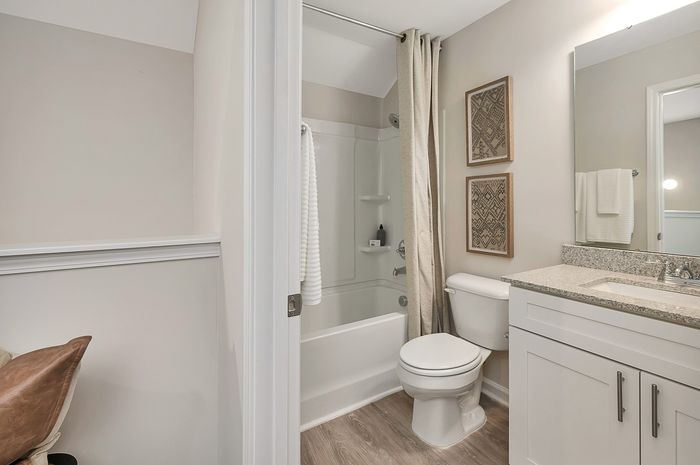 Bathroom with one sink and standard tub