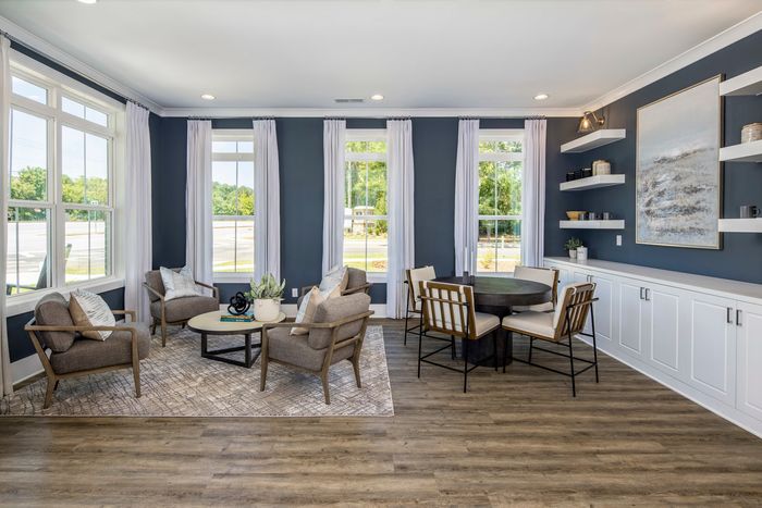 furnished clubroom with seatings and tables