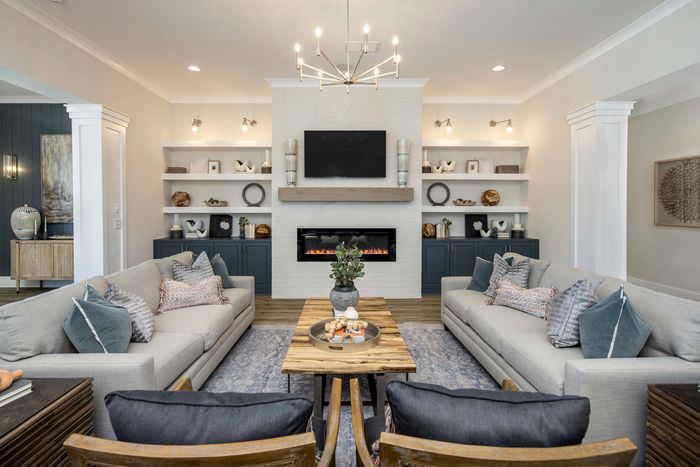 Pet-Friendly Homes in Loganville, GA - Cottages at Loganville -Clubroom with Fireplaces, Comfortable Seating Area, and High Ceilings