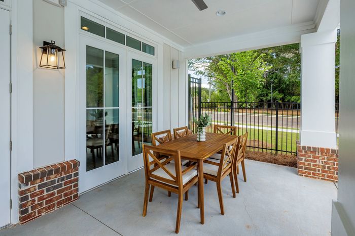 furnished patio area with seating outside of building