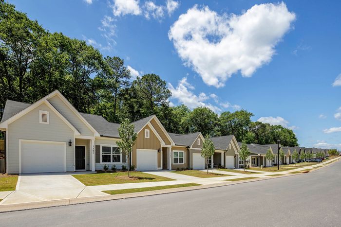 exterior single-family homes with street on sunny day