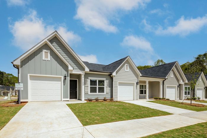exterior row of homes and drivewayson sunny day