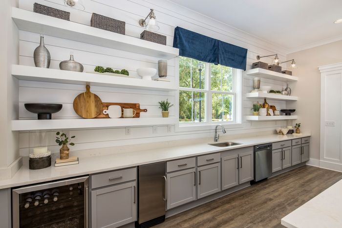 furnished kitchen area of clubroom with appliances and sink