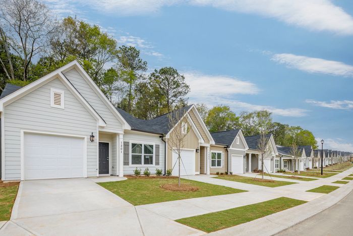 exterior row of homes and drivewayson sunny day