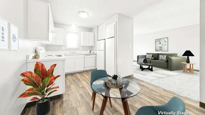 Chic virtually staged apartment featuring a cozy kitchen with modern appliances, stylish dining area, and inviting living room with elegant decor.