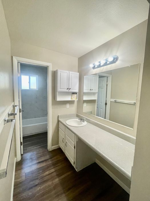 Spacious bathroom with elegant lighting and sleek countertop