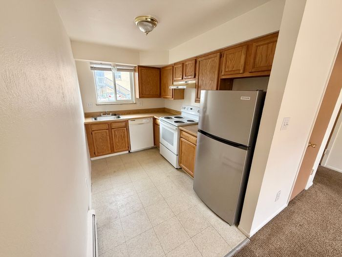 Bright and inviting kitchen with modern appliances, ample cabinetry, and natural lighting.