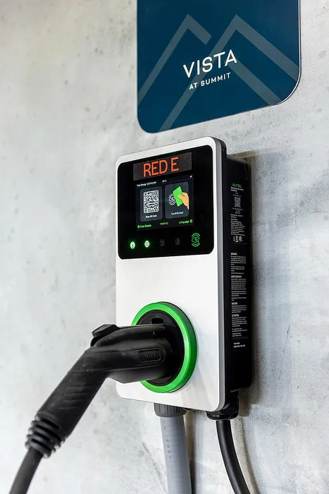 Modern electric vehicle charging station with sleek design at Vista Summit, offering convenient eco-friendly solutions.