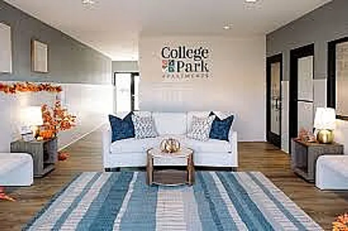 Inviting College Park Apartments living room with modern decor, cozy seating, and stylish accents.