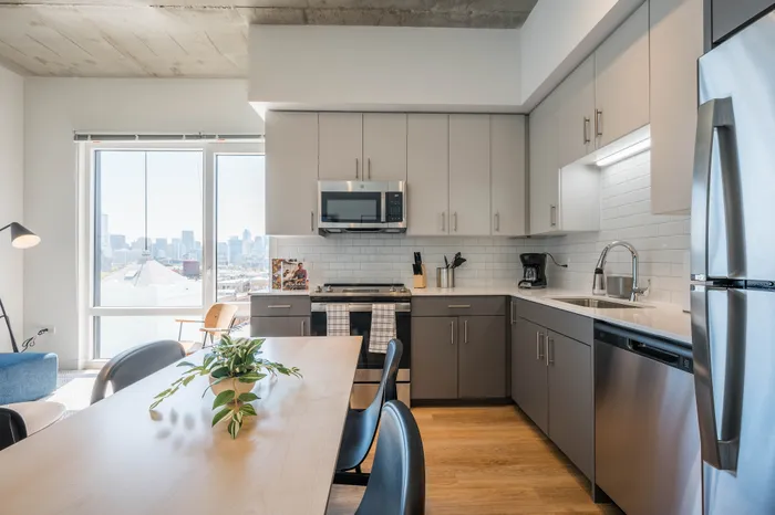 3 Bedroom Student Apartments in Lincoln Park, Chicago, IL | Post Chicago | Kitchen Featuring Stainless Steel Appliances and Tile Backsplash
