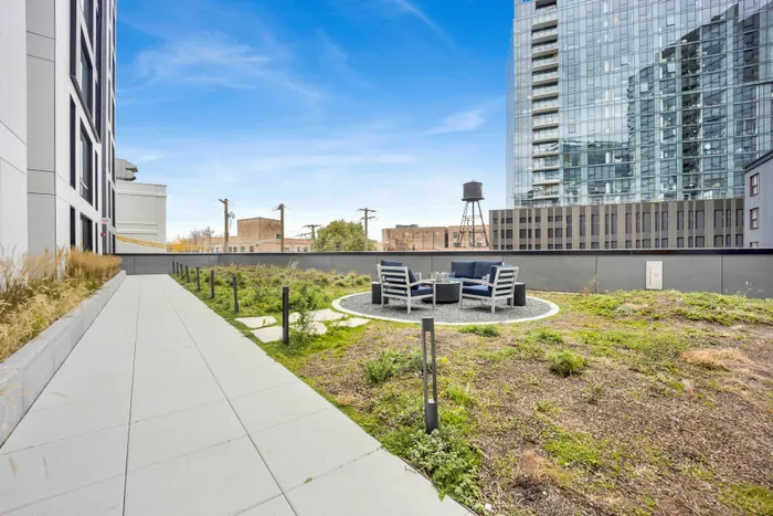 Two Bedroom Student Apartments in Lincoln Park, Chicago, IL | Post Chicago | Outdoor Terrace Featuring Rooftop Landscaping, Seating, and City Views