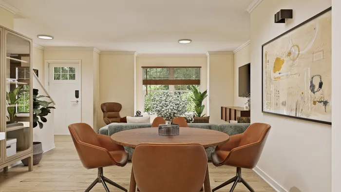 Inviting living room featuring modern furniture, stylish artwork, and abundant natural light creating a warm and welcoming atmosphere.