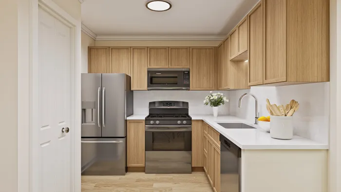 Modern kitchen with sleek stainless steel appliances, warm wooden cabinets, and elegant white countertops, creating a stylish and inviting culinary space.