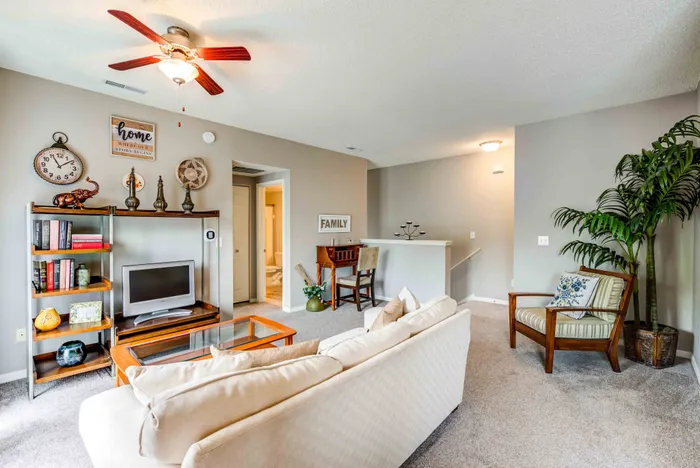 Charming living room with cozy sofa, elegant decor, and a serene ambiance, perfect for relaxation and gatherings.