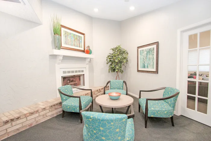 Cozy and inviting clubhouse lounge featuring a stylish fireplace.