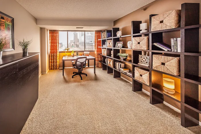 Bright and inviting home office with expansive city views.