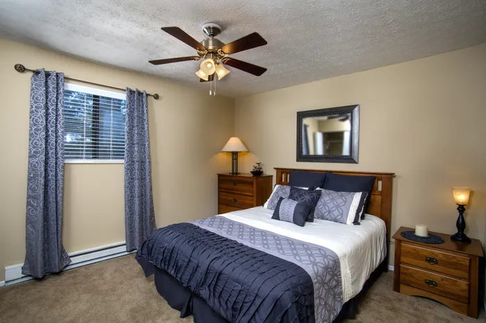 Inviting bedroom with elegant decor, plush bedding, and soft ambient lighting for a relaxing retreat.