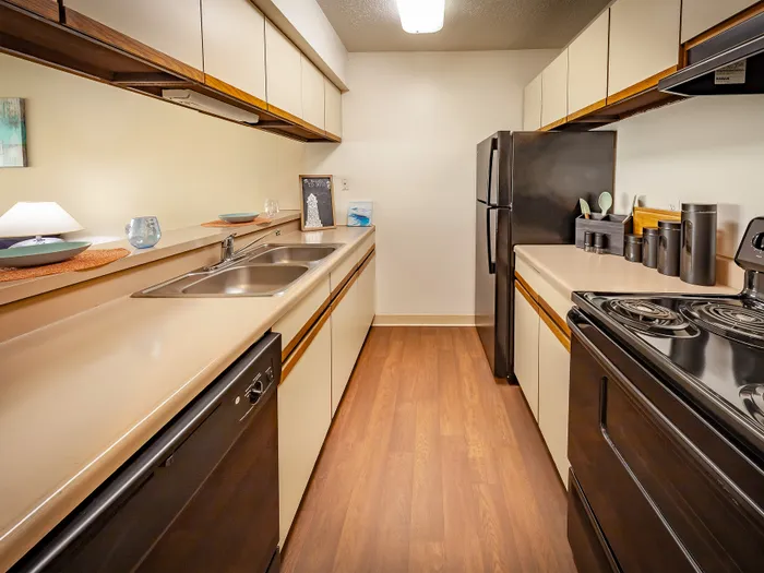 Modern kitchen with sleek appliances, generous counter space, and polished hardwood floors, perfect for culinary creativity.