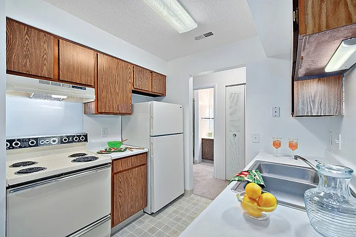 Bright and inviting kitchen with wooden cabinets, and modern appliances.