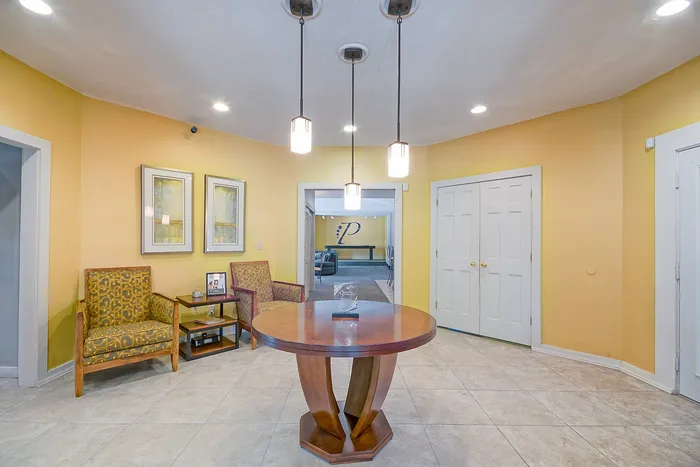 Elegant lobby area featuring warm lighting, modern decor, and inviting seating.
