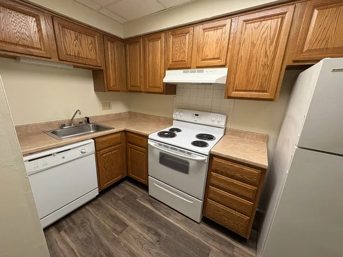 Charming U-shaped kitchen with oak cabinetry Braeburn Village