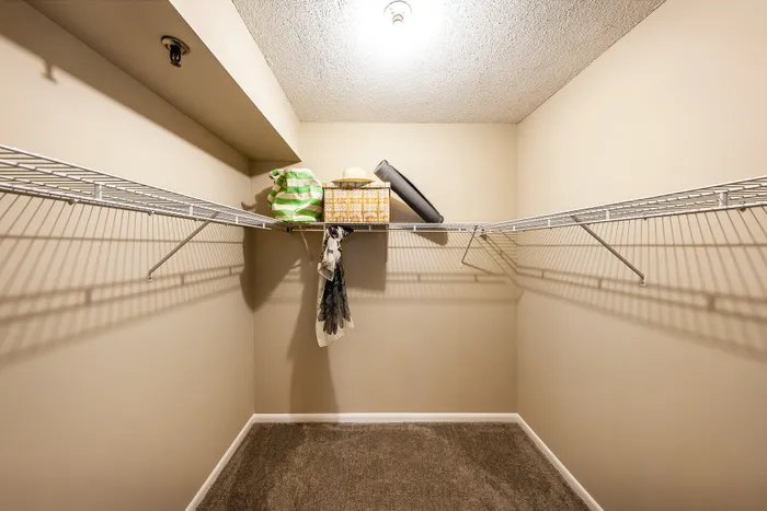 Spacious walk-in closet with organized shelving and ample storage space.