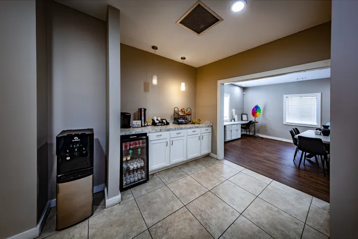 Pebble Point Apartments - Inviting coffee bar and beverage cooler in the leasing office.