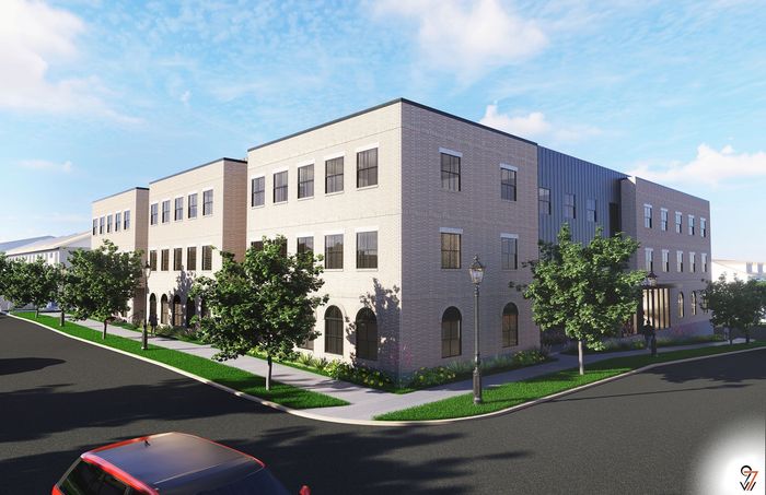 Modern three-story apartment building with elegant brick facade, surrounded by lush greenery and clear skies.