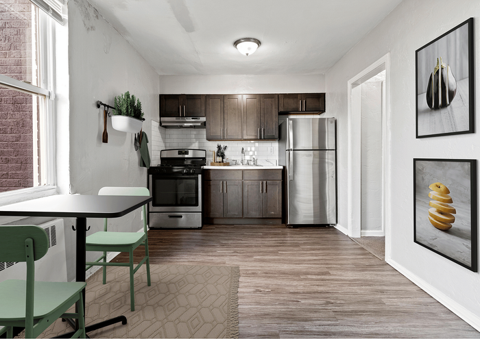 Inviting kitchen with wooden cabinets, stainless steel appliances, and cozy dining area.
