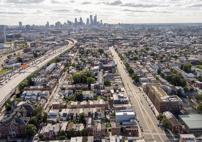 Aerial view of a bustling cityscape with a vibrant urban landscape and towering skyline.