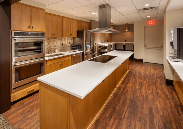 Contemporary kitchen featuring a spacious island, modern appliances, and a cozy breakfast nook.