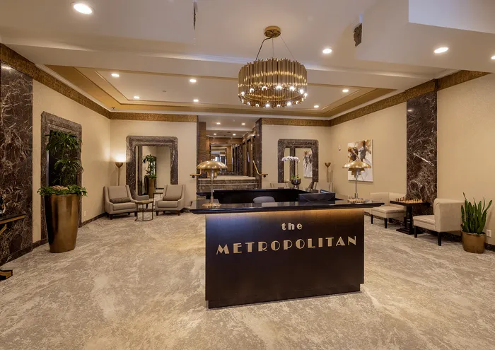 Elegant hotel lobby with plush seating, stylish lighting, and marble accents at The Metropolitan.