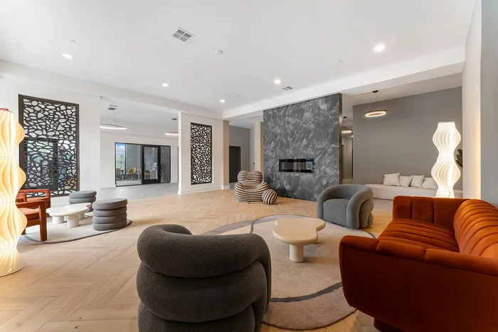 Contemporary lounge space with chic seating, modern design elements, and elegant lighting fixtures, perfect for relaxation and social gatherings.