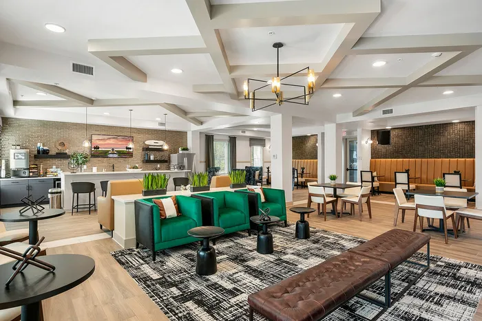 Chic and modern lounge area featuring stylish seating, contemporary lighting, and an inviting open layout.