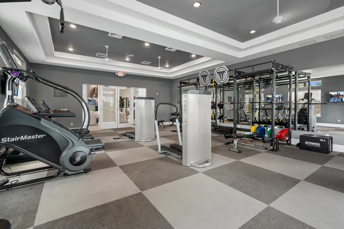 Modern fitness center with state-of-the-art equipment, sleek design, and ample workout space for a healthy lifestyle.