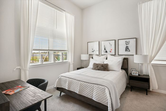 Apartments In Kissimmee, FL With In-Unit Washer And Dryer &ndash; 14Fifty Neo &ndash; Bedroom With Contemporary Custom Cabinetry And Modern Design.