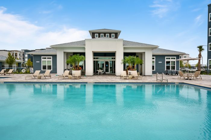 Kissimmee, FL Pet-Friendly Apartments &ndash; 14Fifty Neo &ndash; Swimming Pool With Private Clubhouse Lounge And Outdoor Pool Area.