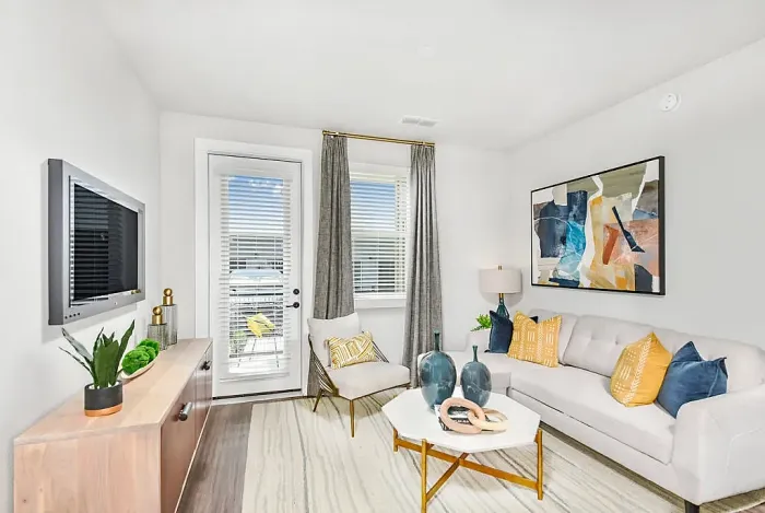 Modern kitchen with sleek white cabinetry, stainless steel appliances, and elegant granite countertops, perfect for culinary creativity.
