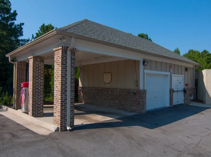 Charming brick-built car wash station featuring convenient access and a sleek modern design.
